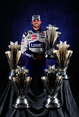 2010 NSCS Jimmie Johnson holds trophy. Credit: Rusty Jarrett/Getty Images for NASCAR